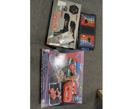 A BOXED CARS SCALEXTRIC PHOTON TARGET GAME AND BATTLESHIPS