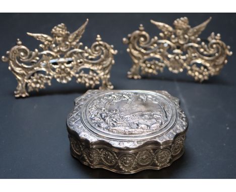 A pair of late Victorian pierced scroll silver menu holders, Stuart Clifford, London, 1899/1900, 52mm, and a 900 snuff box.CO