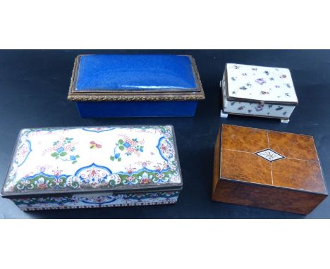 A burr wood cigarette box and three ormolu mounted ceramic caskets, largest 20cmCONDITION: - cigarette box with ivory and ebo