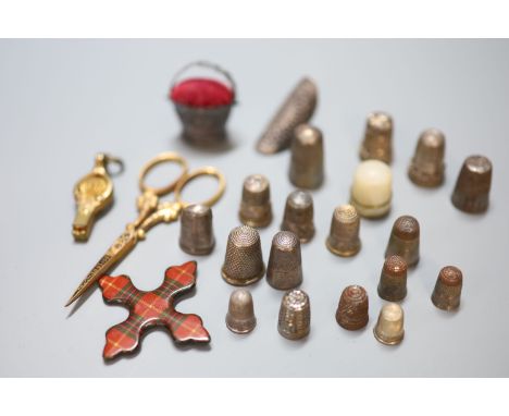 A collection of assorted thimbles and other sewing accessories including silver and mother of pearlCONDITION: - Victorian whi