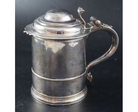 A late Queen Anne silver tankard, maker R?, London, 1713, 17.4cm, 21.5oz (a.f.).CONDITION: Quite poor condition. Numerous sma