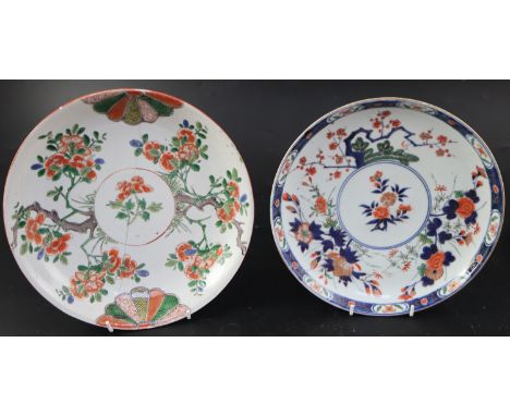A Chinese Kangxi famille verte saucer dish, decorated with flowers branches and mon motifs, 26.75cm, and an 18th century Japa