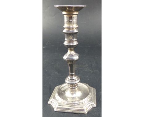 A George II cast silver candlestick, by Abraham Buteux, London, c.1725, 14.7cm, 11oz, with later added plated sconceCONDITION