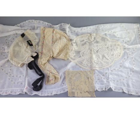 A fine white worked embroidered lace inset coverlet, a filet lace square of a figure wearing a crown (plus museum note), a si