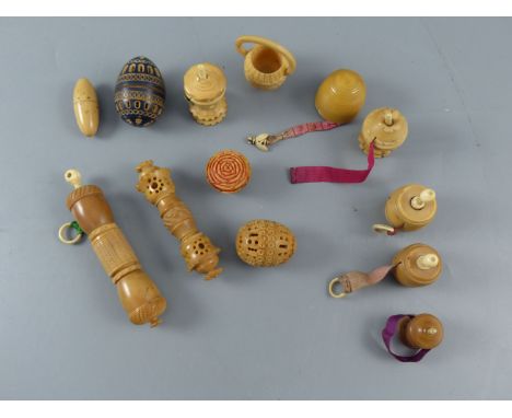 A collection of assorted 19th century carved and turned coquilla nut sewing accessoriesCONDITION: - acorn finial combined nee