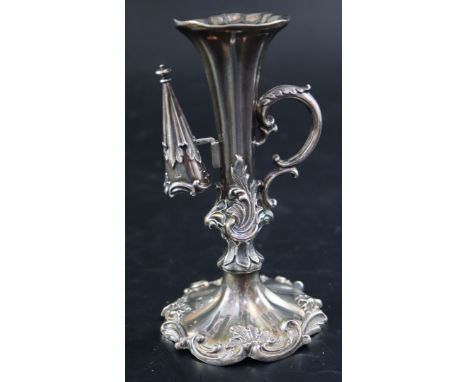 An ornate Victorian silver chamberstick, Henry Wilkinson &amp; Co, Sheffield, 1842, snuffer 1839, 14.3cm, gross 194 grams.CON
