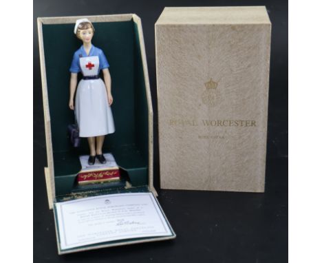 A Royal Worcester model of a British Red Cross Society V.A.D. Member, no.306/750, with original box and certificate, height 2