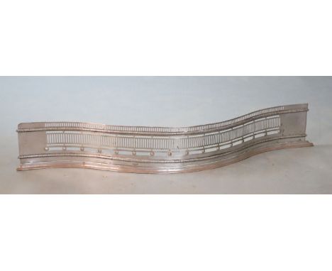 A George III style polished steel serpentine fender, W.107cmCONDITION: Slightly bent out of shape with light oxidisation spot