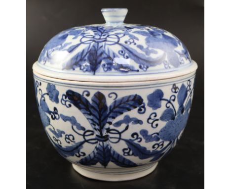 A Japanese blue and white tureen and cover, c.1700, painted in underglaze blue with stylised flowers and foliage, the domed c