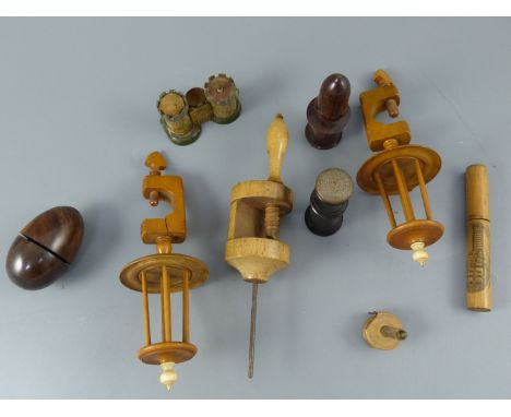 A group of Victorian treen sewing accessories including a pair of boxwood winding spool clampsCONDITION: - pair of clamps wit