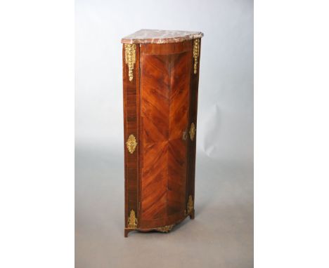 A Louis XV / XVI ormolu mounted kingwood encoignure, with marble top and single quarter veneered door enclosing two shelves, 