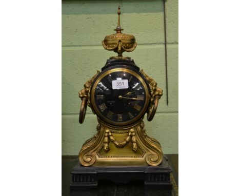 A French black slate, gilt metal mounted striking mantel clock