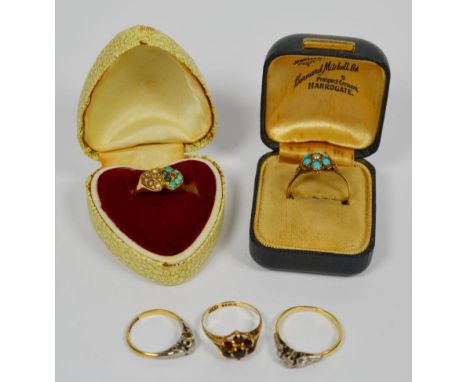 A 22 carat gold turquoise and seed pearl ring, finger size R, a 9 carat gold garnet ring, finger size M, a diamond solitaire 