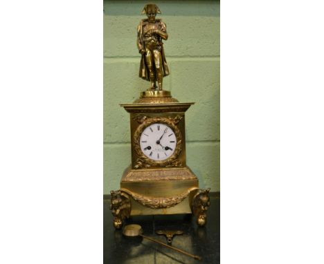 A French gilt metal striking mantel clock, enamel dial, signed Bourdin Cour des Fontaines, surmounted with a figure of Napole