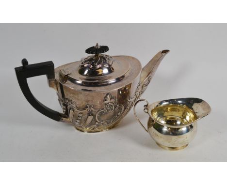 A Victorian silver teapot, by Charles Stuart Harris, London, 1898, tapering oval, the lower body spiral-fluted and chased wit
