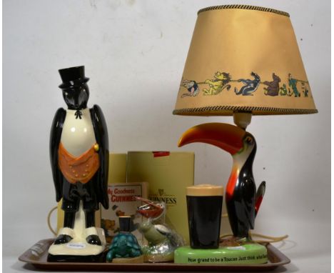 A Carltonware Guinness lamp; with other items