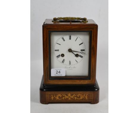 A French inlaid striking mantel clock, retailed by Sewell &amp; Son, A Paris, movement back plate stamped Japy Freres, 19th c