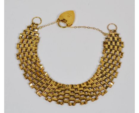 A gate link bracelet, with a 9 carat gold padlock clasp, length 19cm.  Gross weight 12.0 grams.