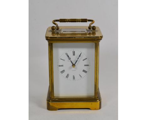 A brass striking carriage clock, signed Matthew Norman, London