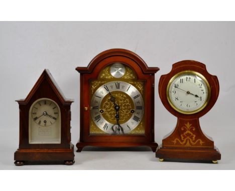 An Edwardian inlaid mahogany mantle timepiece, another mahogany timepiece signed Kleyser &amp; co, 66 High Street Suffolk, an