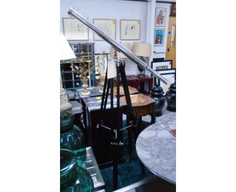 TELESCOPE, in chromed metal on extended tripod support, 160cm H. 
