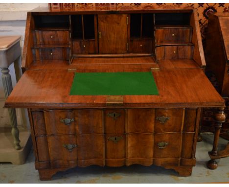 BUREAU, mid 18th century Dutch walnut and oak with a fall front enclosing a fitted interior of miniature drawers, compartment