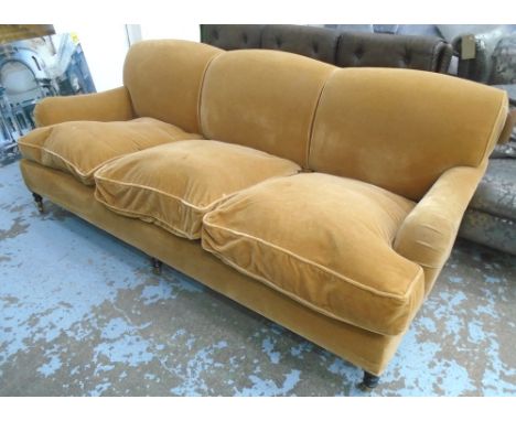 GEORGE SMITH SOFA, three seater, in brown fabric on turned castor supports, label under, 226cm L.