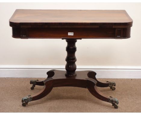 Regency rosewood card table, baize lined folding swivel top on baluster column and platform base with four sabre legs, W90cm 
