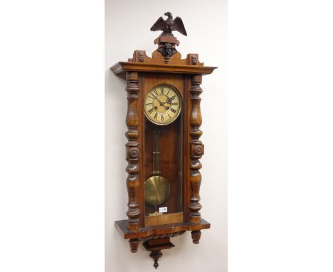 Victorian Vienna walnut wall clock with eagle cresting, Roman dial and twin train movement striking the half hours on a gong,