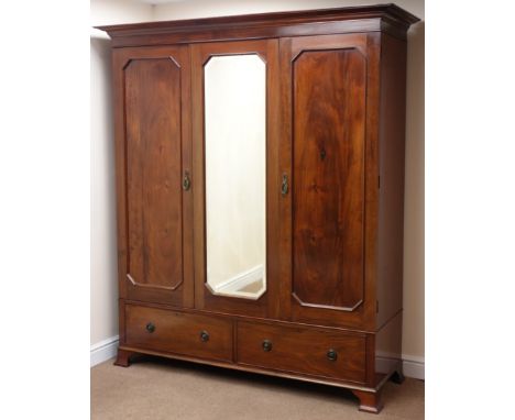 Edwardian mahogany triple wardrobe, projecting cornice, two doors flanking central bevel edge mirror with canted corners abov