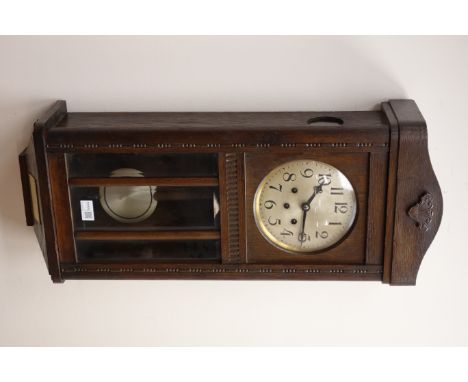 20th century oak presentation wall clock with bevel glazed door, silvered dial and Westminster chiming triple train movement 