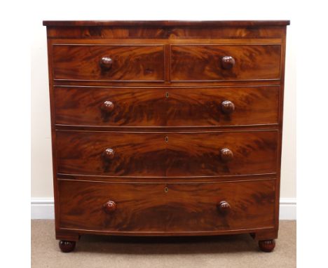 Victorian bow front mahogany chest, two short and three long cockbeaded drawers with turned wooden handles on turned feet, W1