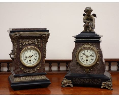 Victorian style black slate and simulated marble mantle clock with gilt metal Cupid figure and mounts enclosing a modern bras