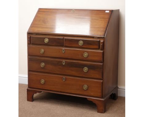 Early 20th century mahogany bureau, fall front enclosing fitted interior above two short and three long graduating drawers, s