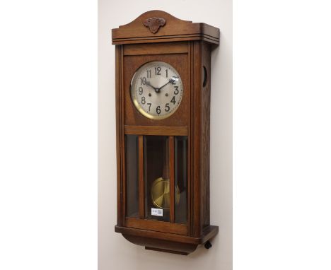 20th century oak wall clock with bevel glazed door, silvered dial and twin train movement with pull repeat, striking the half