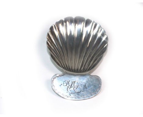 A George III silver caddy spoon, possibly John Kidder, London 1807, with scallop shell bowl, the curved handle engraved with 