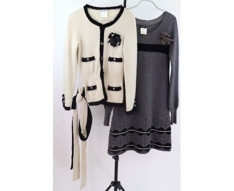 Chanel: Cream cardigan with black edging and floral corsage and a woolen knitted dress (2).