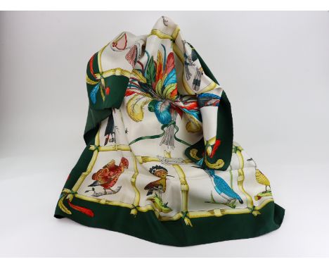 Gucci: Silk hand rolled scarf featuring exotic birds.