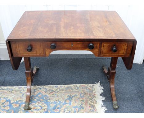 A Regency rosewood sofa table, boxwood and ebony strung and satinwood crossbanded, fitted with three drawers around an arched