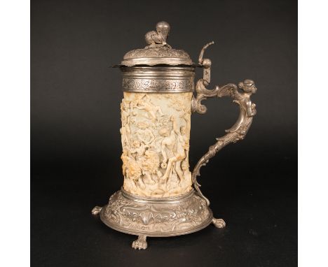 Large ivory tankard, in the centre finely and deeply carved scene with allegory of the fortunate harvest in silver mount with