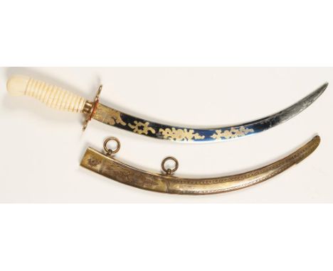 A GEORGIAN MIDSHIPMAN'S NAVAL DIRK, and scabbard, ivory grip and engraved curved steel blade with blueing, 13.5"