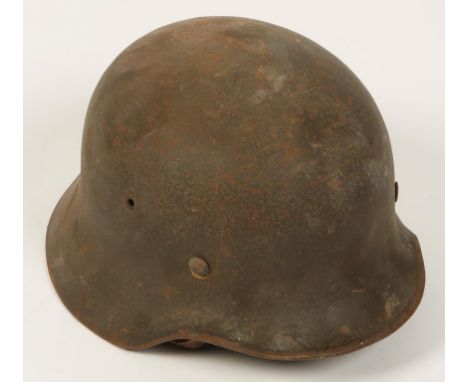 A GERMAN NAZI HELMET, with original lining, chin strap, and decal.