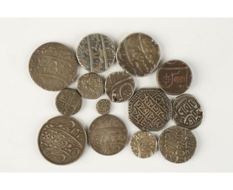 INDIA, MIXED COINS. A collection of silver denominations.