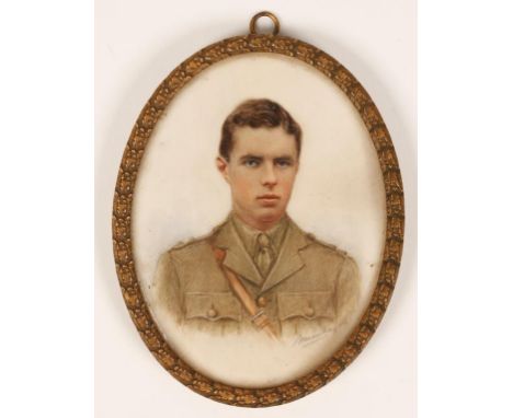 A FIRST WORLD WAR PERIOD MINIATURE PORTRAIT of a young soldier in uniform, in a gilt brass frame, 4" x 3"