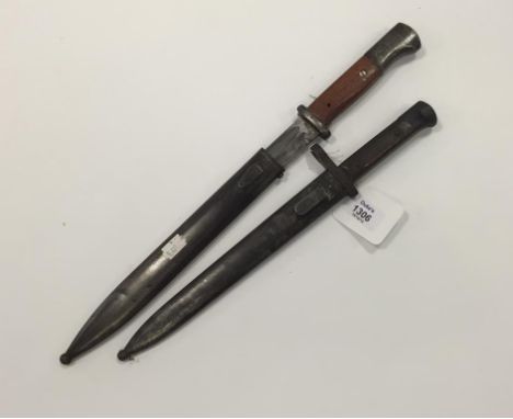 A GERMAN BAYONET with scabbard, 14.5", and one other German bayonet, 16" (2)