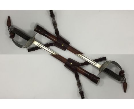 A GEORGE V OFFICERS SWORD, with leather scabbard, 41"