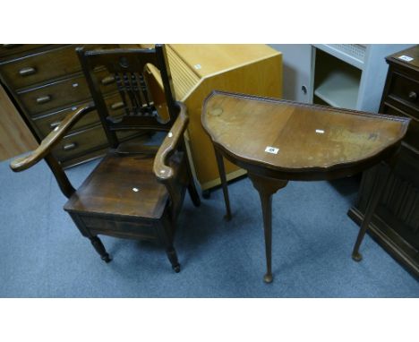 A 20th Century carved oak commode and side table with shaped top. (2)