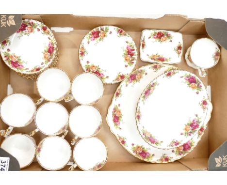 A collection of Royal Albert Old Country Rose items to include cups, saucers, side plates, serving platters, etc. 
