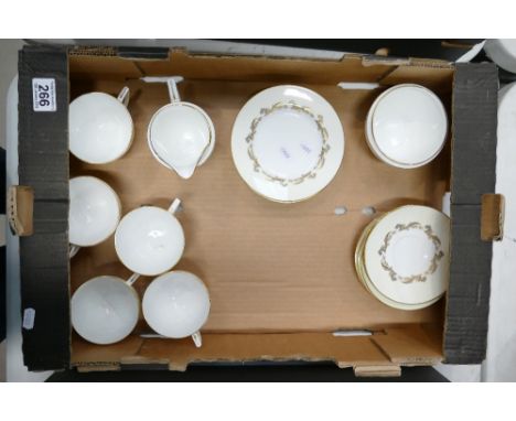 A collection of Minton Gold Laurentiam patterned dinner ware to include cups, saucers, milk jugs, plates, (17)