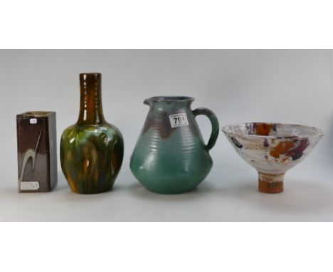 A collection of studio pottery including footed dish impressed RW, mottled blue jug, Linthorpe dimpled mottled green vase and